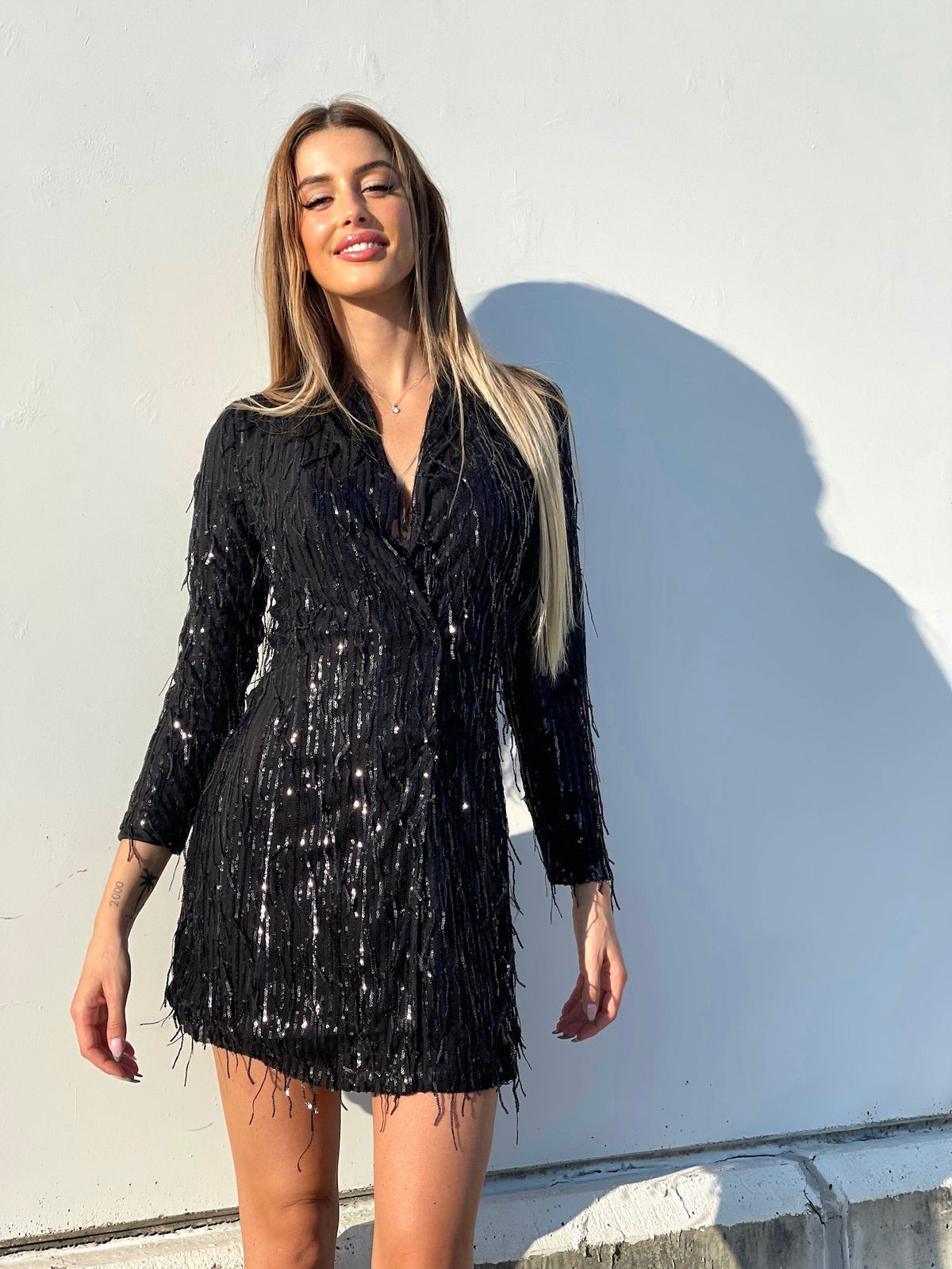 Abito nero frange in paillettes