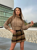 Maglione beige con trecce