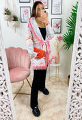 Cardigan A rombi bianco con frange e cinta