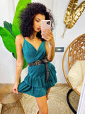 Abito corto verde bottiglia glitter con gonna asimmetrica
