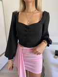 Top con bottoncini nero