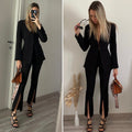 Pantalone a zampa nero con spacco