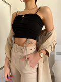 Top drappeggiato con fiocchetti