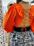 Blusa schiena aperta con lacci