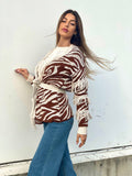 Cardigan zebrato beige con frange e cinta