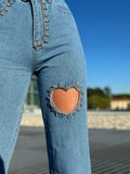 Jeans con strass e cuore