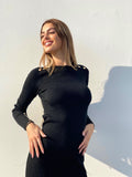 Abito nero con bottoncini oro