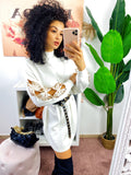 Abito in maglia con fiocchetti e paillettes