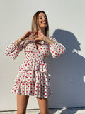 Abito bianco a balze con cuori rossi