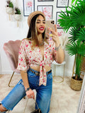 Blusa floreale con fiocco