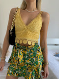 Top in pizzo giallo con pizzo