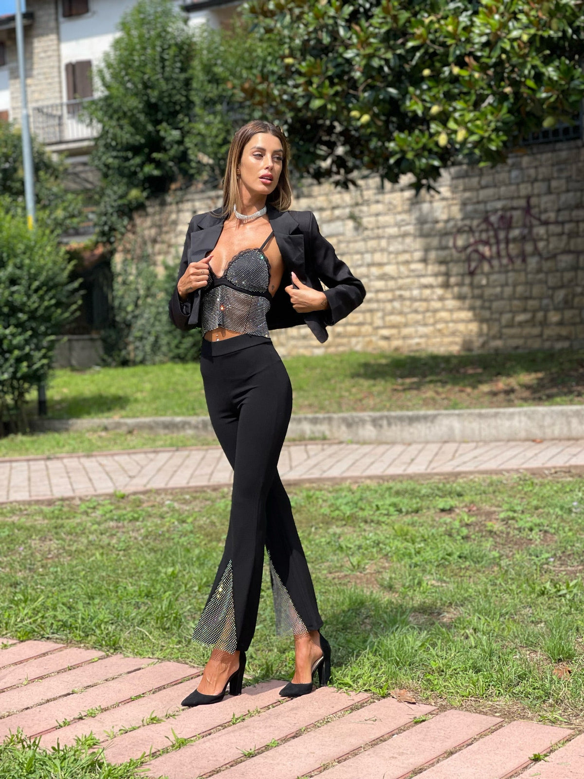 Pantaloni a zampa con strass