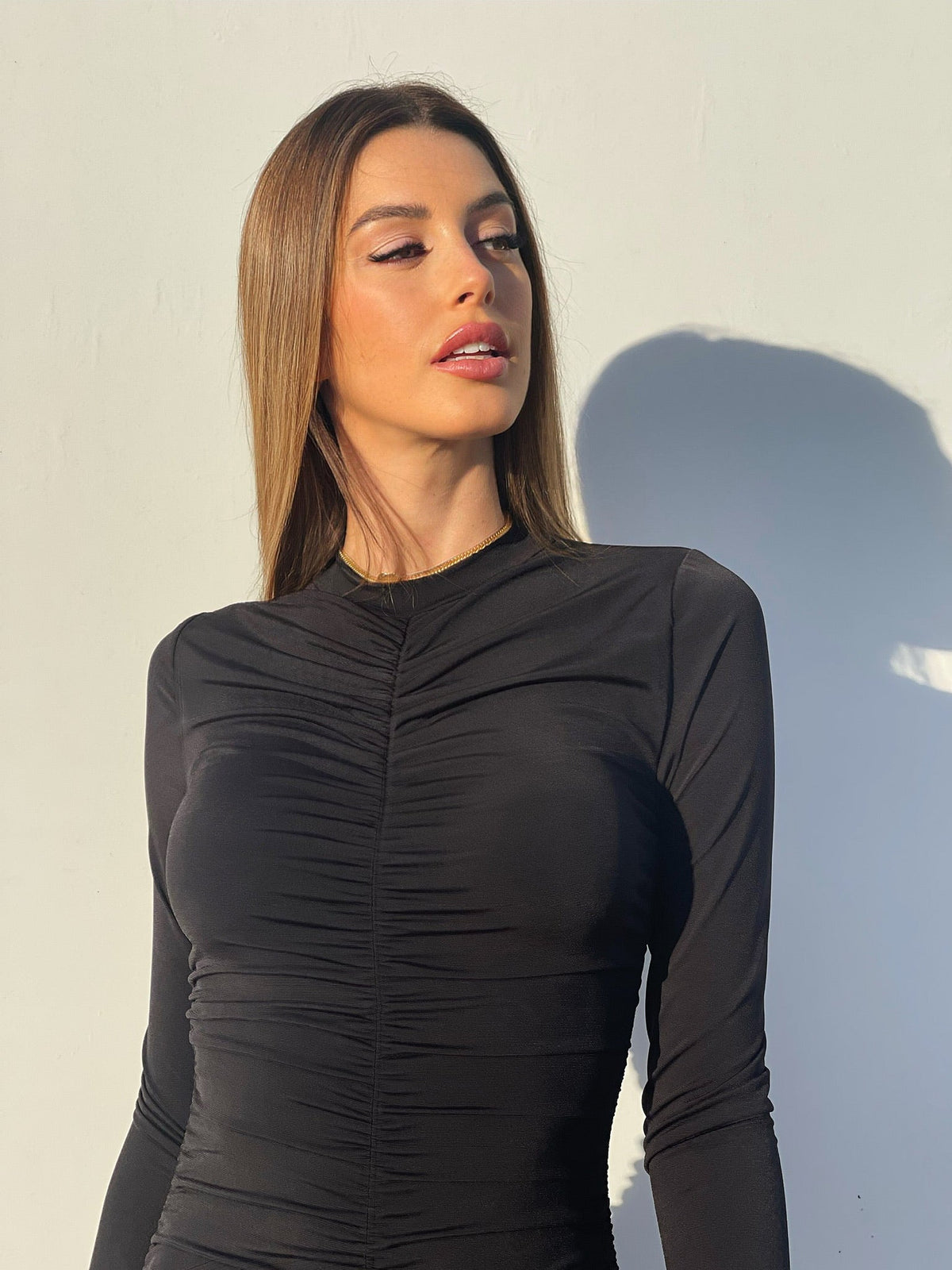 Abito nero con drappeggio