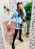 Cardigan con frange e cinta celeste