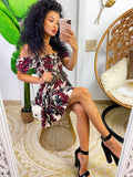 Abito a fiori bordeaux con scollo a barchetta