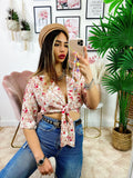 Blusa floreale con fiocco