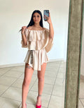 Tutina beige scollo a barchetta e balze