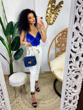 Pantalone in ecopelle con fiocco bianco
