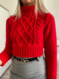 Maglione rosso a trecce