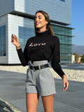 Pull nero e rosa