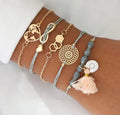 Bracciale con infinito e dettagli rosa grigio