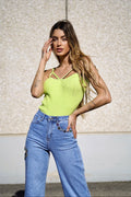 Top verde con anelli oro