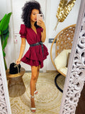 Abito corto bordeaux con gonna asimmetrica