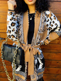 Cardigan camel con frange e cinta
