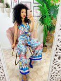 Tuta intera con base celeste blu fiori fuxia