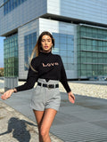 Pull nero e rosa