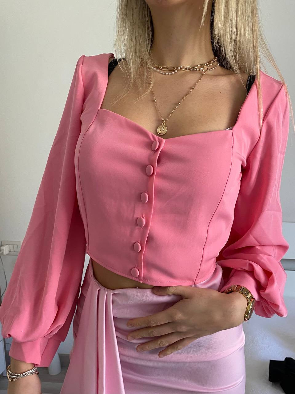 Top con bottoncini rosa