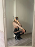 Pantalone in ecopelle con trasparenze
