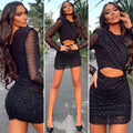 Abito nero con trasparenze e glitter