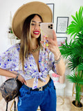 Blusa floreale con fiocco