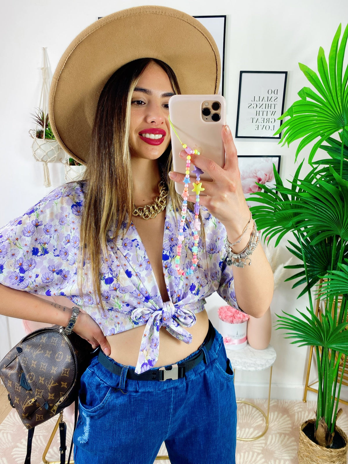 Blusa floreale con fiocco