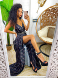 Abito in raso con maxi spacco nero a pois
