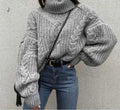 Maglione a collo trama a trecce