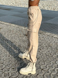 Pantalone in ecopelle con catenina beige
