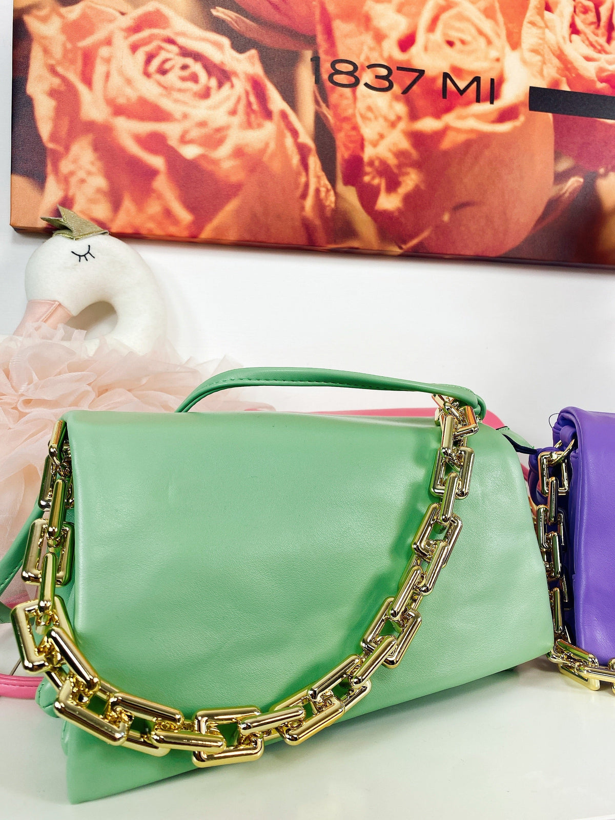 Pochette a mano con catena colori accesi