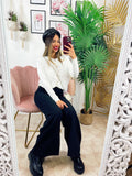 Maglione con bottoni gioiello e pizzo bianco