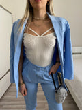 Top bianco con anelli oro