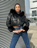 Giaccone in ecopelle nero con pelo