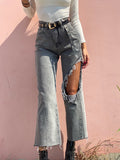 Jeans con maxi spacco grigio