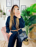 Jogger gamba larga e croptop nera