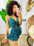 Abito corto verde bottiglia glitter con gonna asimmetrica
