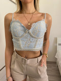 Top in pizzo con perle celeste