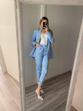 Top bianco con anelli oro