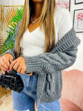 Cardigan grigio con trecce