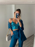 Top con paillettes petrolio