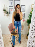 Jeans a vita alta con spacco inferiore